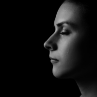 1 silhouette of a woman divided between light and shadow